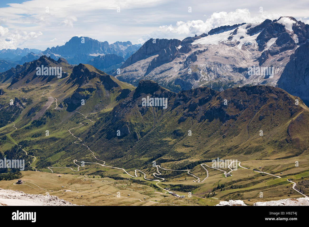 View from the Canazei ski resort showing the distant Dolomite mountain range, Trentino region, South Tyrol, Italy. Stock Photo