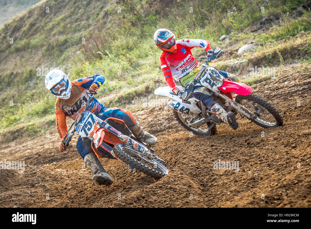 motocross riders in the race Stock Photo - Alamy