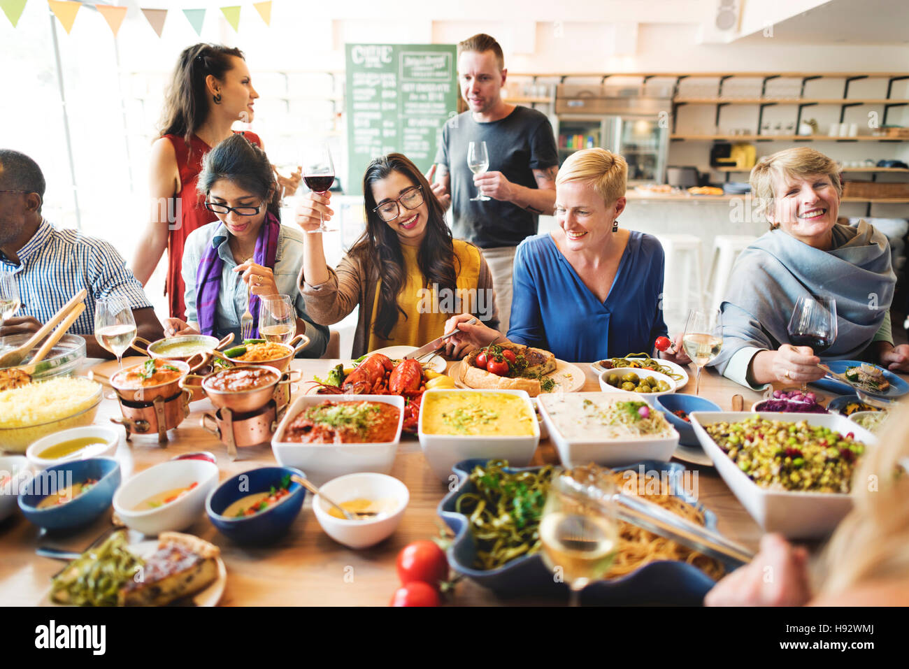 Friends Party Buffet Enjoying Food Concept Stock Photo - Alamy