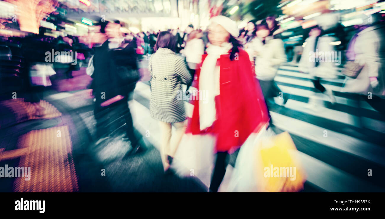 Large Crowd Walking in a City Cross Street Concept Stock Photo