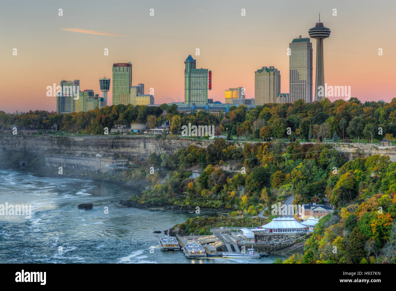 A view of the Niagara River and skyline of Niagara Falls, Ontario just before sunrise. Stock Photo