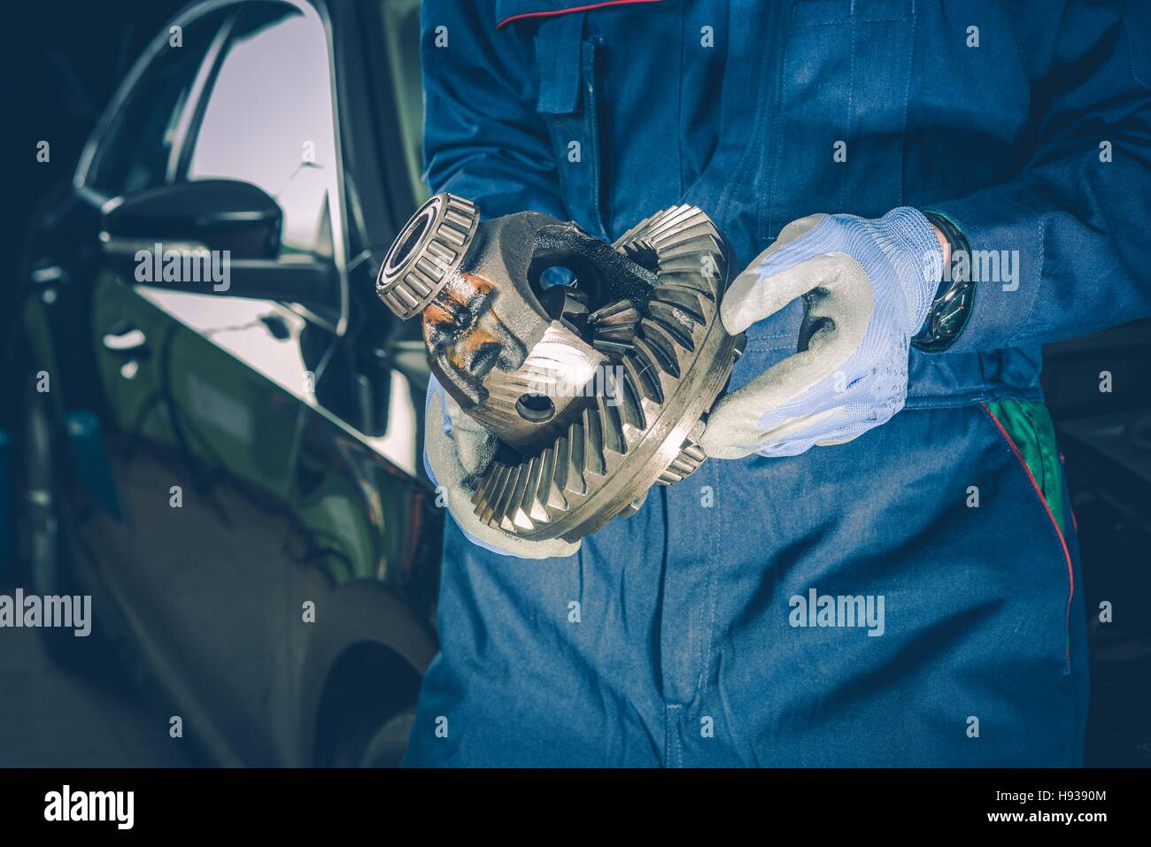 Broken Automotive Differential in a Hands of Car Mechanic. Replacement