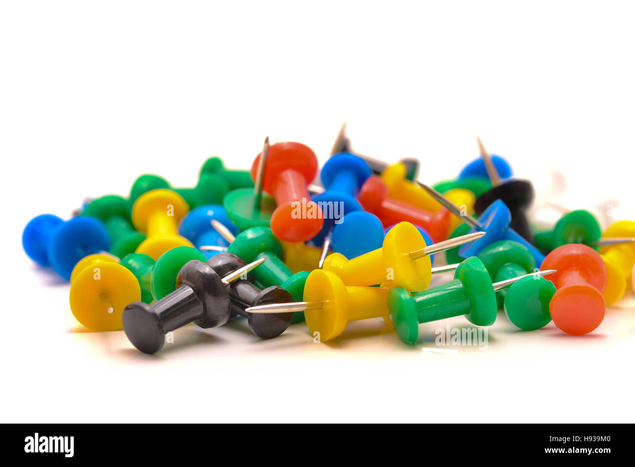 Thumbtacks on the table in natural light Stock Photo