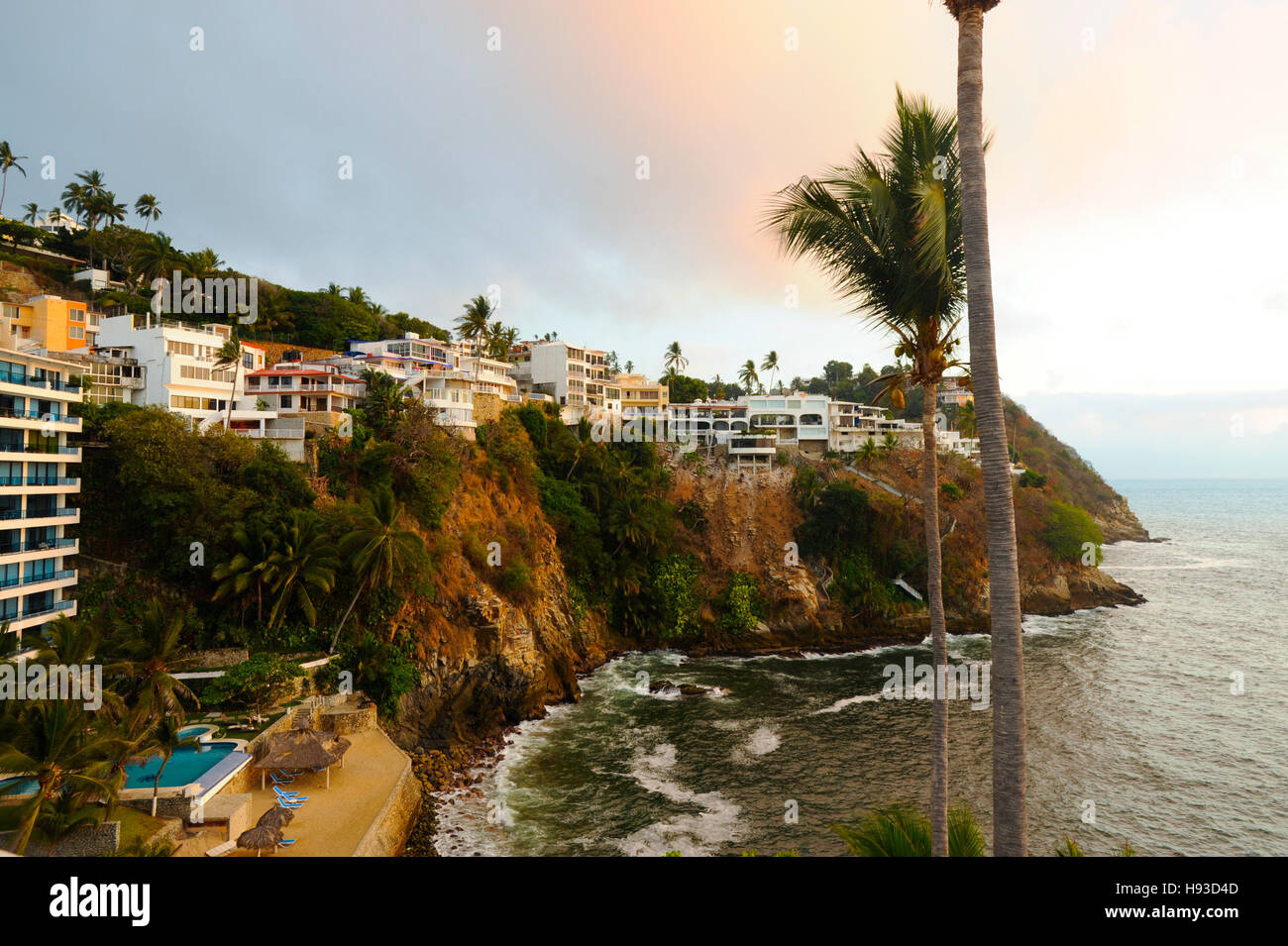 Coastal homes and apartments on cliffs above Pacific Ocean in Acapulco, Mexico. Property released. Stock Photo