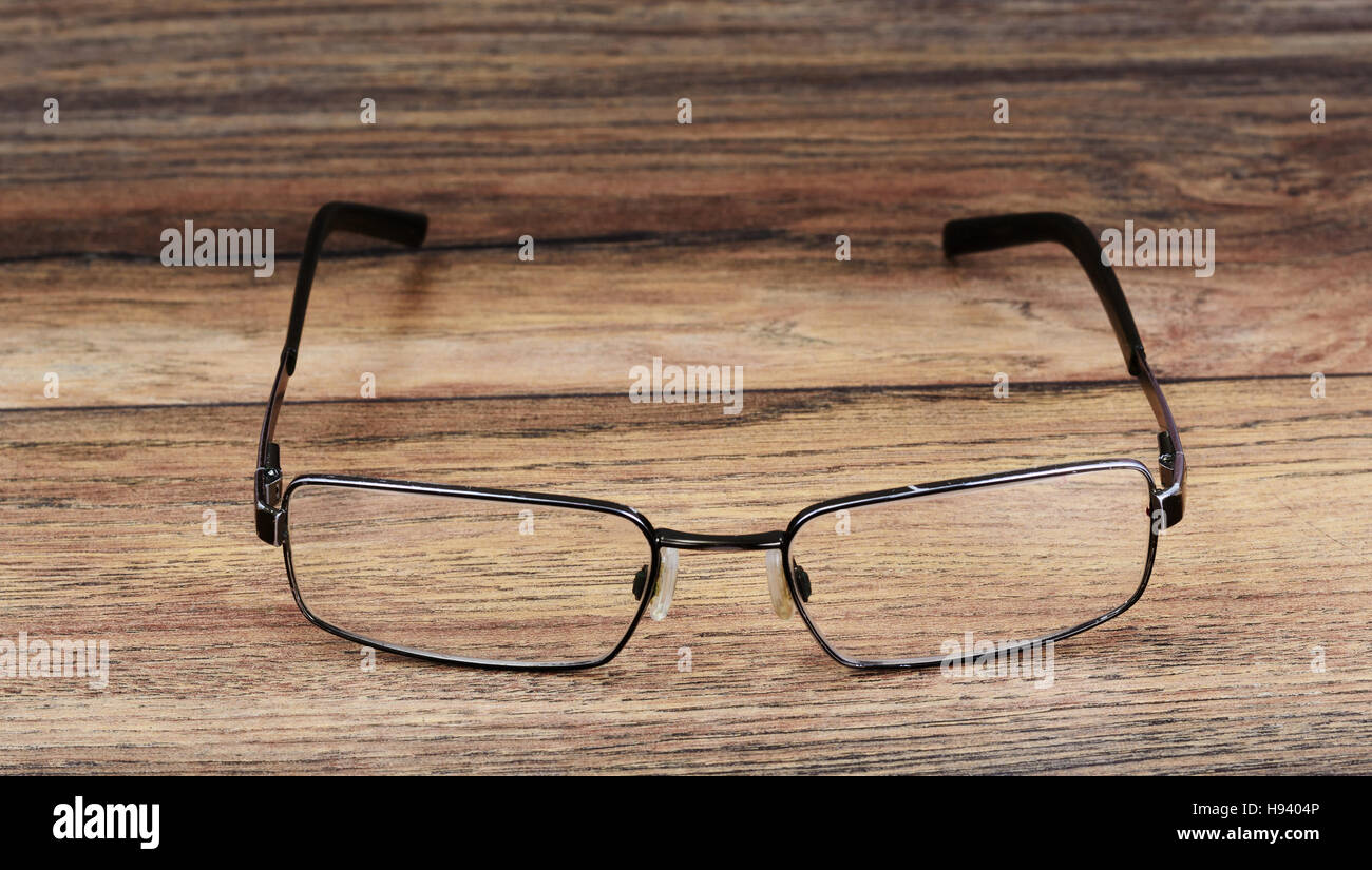 Spectacles. Glasses on Wood Background Stock Photo - Alamy