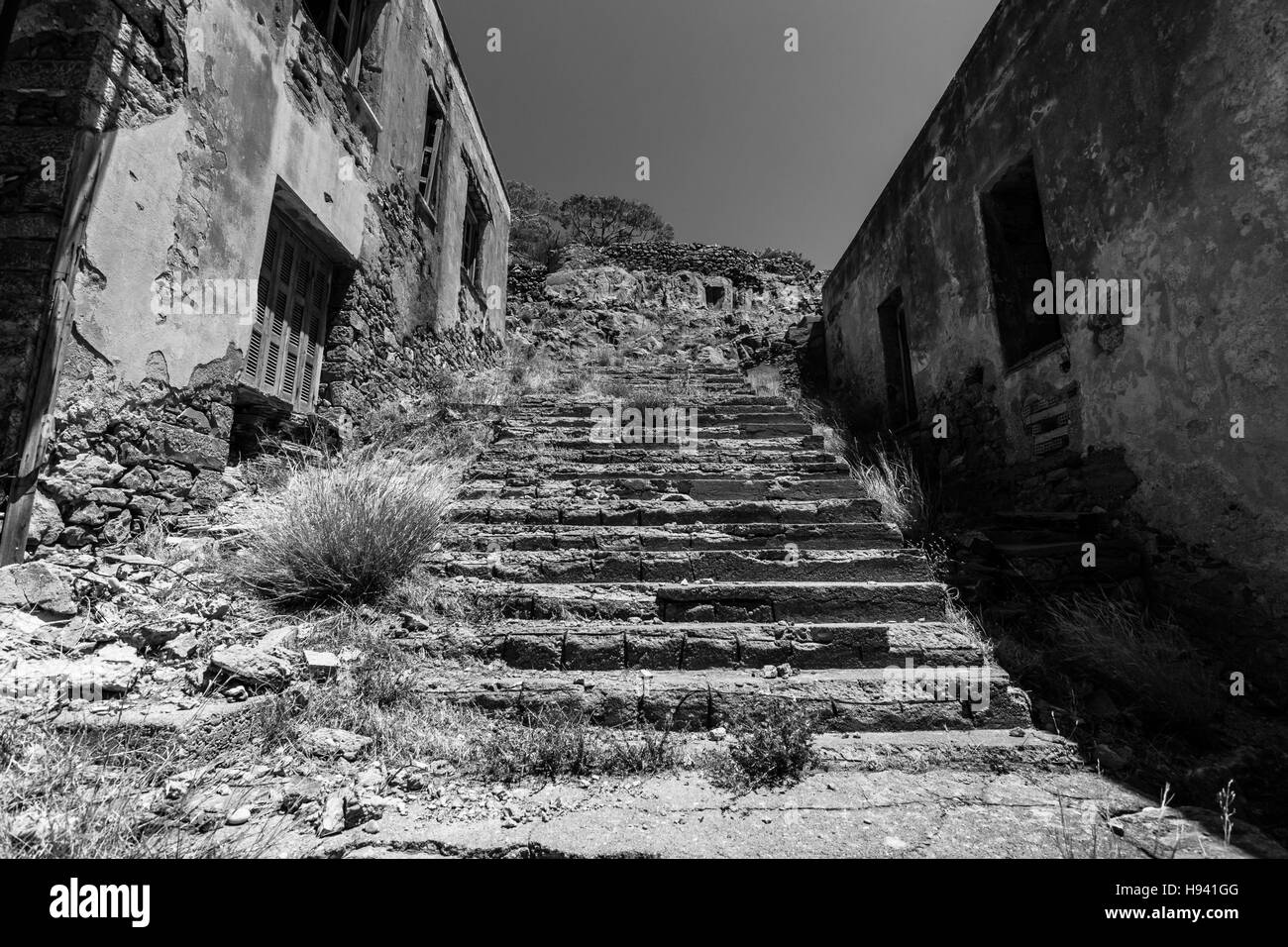 The ruins of the leper colony closed in the 50s on the ruins of a Venetian fortress on Spinalonga island. Crete. Greece. Black and white. Stock Photo