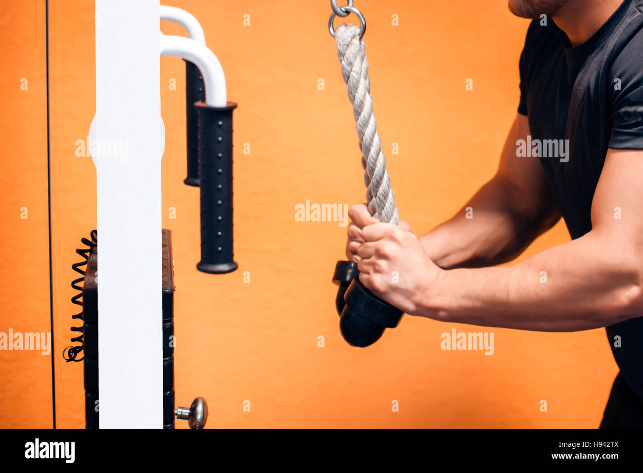 Triceps Exercise With Cables Stock Photo - Alamy