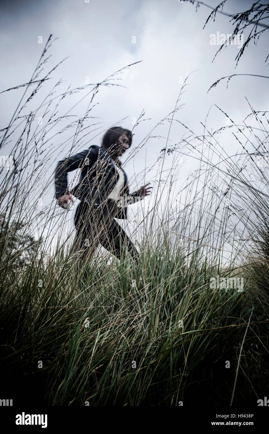 Running scared woman hi-res stock photography and images - Alamy