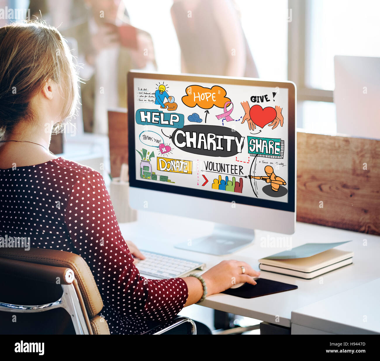 Woman volunteer laptop in hi-res stock photography and images - Alamy
