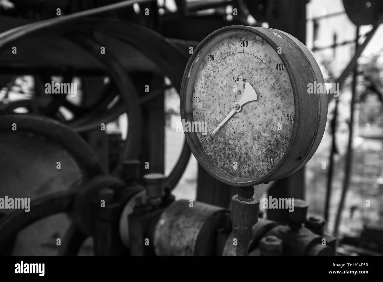 Rusty old pressure gauge in black and white. Stock Photo
