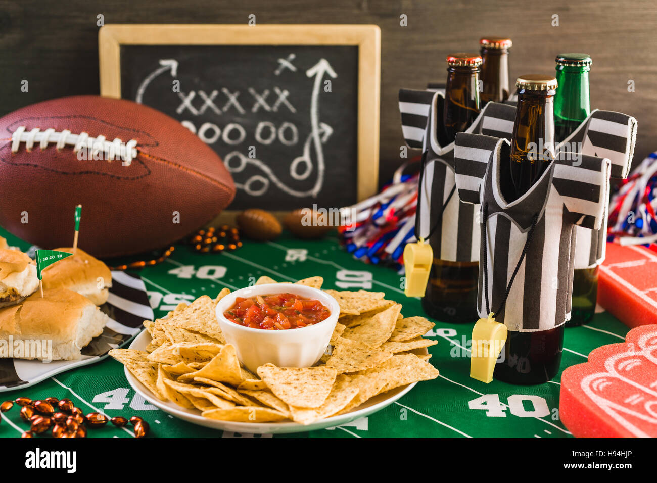 Game day football party table with beer, chips and salsa Stock Photo