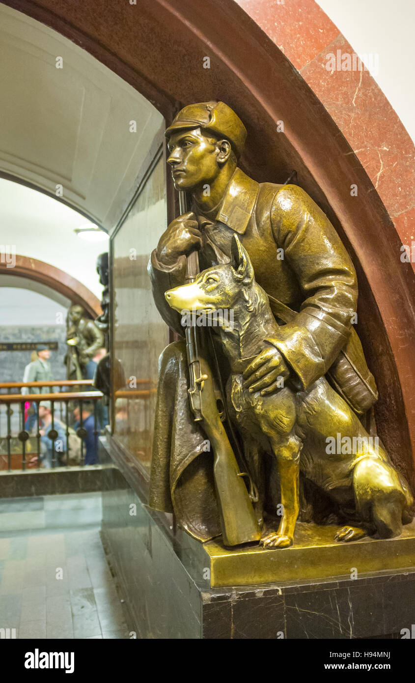 The bronze sculpture of a frontier guard with a dog in hall
