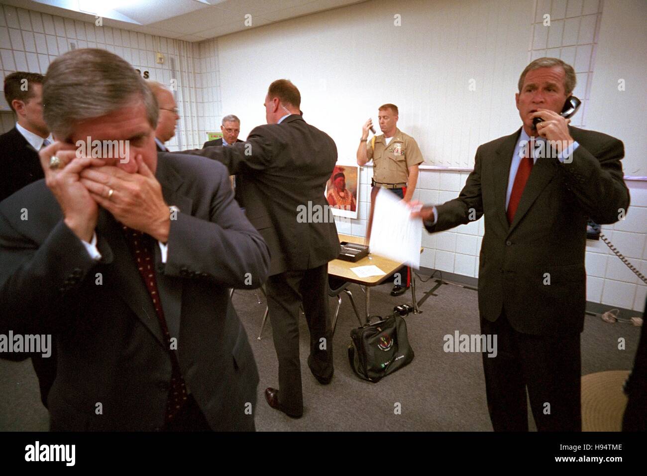 U.S. President George W. Bush and White House Chief of Staff Andy Card make phone calls after hearing news of the September 11 terrorist attacks during a visit to the Emma E. Booker Elementary School September 11, 2001 in Sarasota, Florida. Stock Photo