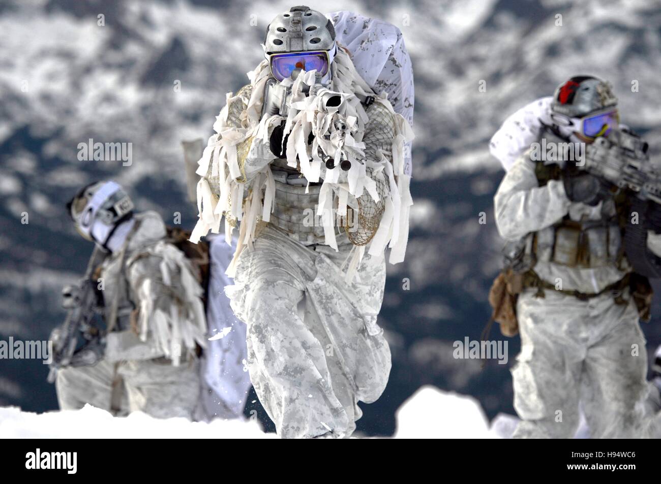U.S. Navy SEAL soldiers demonstrate winter warfare techniques in snow camouflage December 9, 2014 in Mammoth Lakes, California. Stock Photo