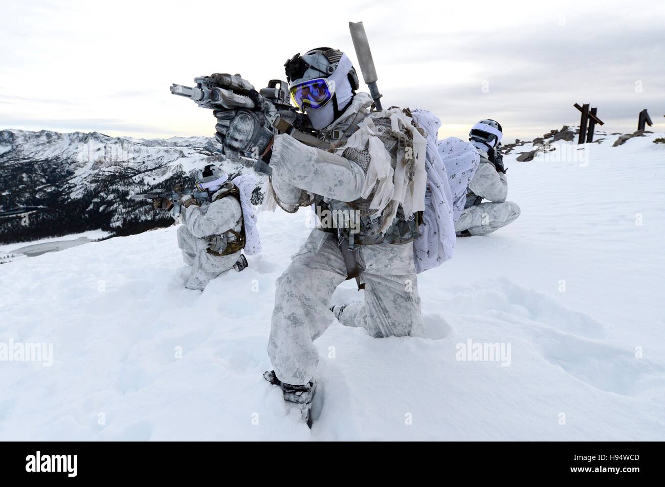 U.S. Navy SEAL soldiers demonstrate winter warfare techniques in snow camouflage December 9, 2014 in Mammoth Lakes, California. Stock Photo