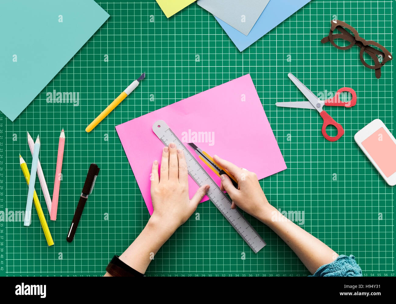 Woman Cutting Paper Stationery Workstation Concept Stock Photo