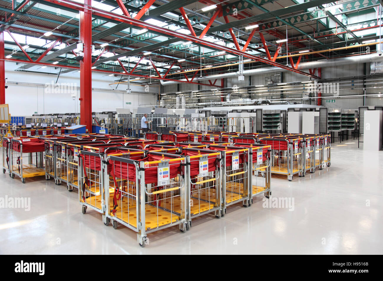Empty mail trolleys awaiting use in a new Post Office sorting office in Southern England, UK Stock Photo