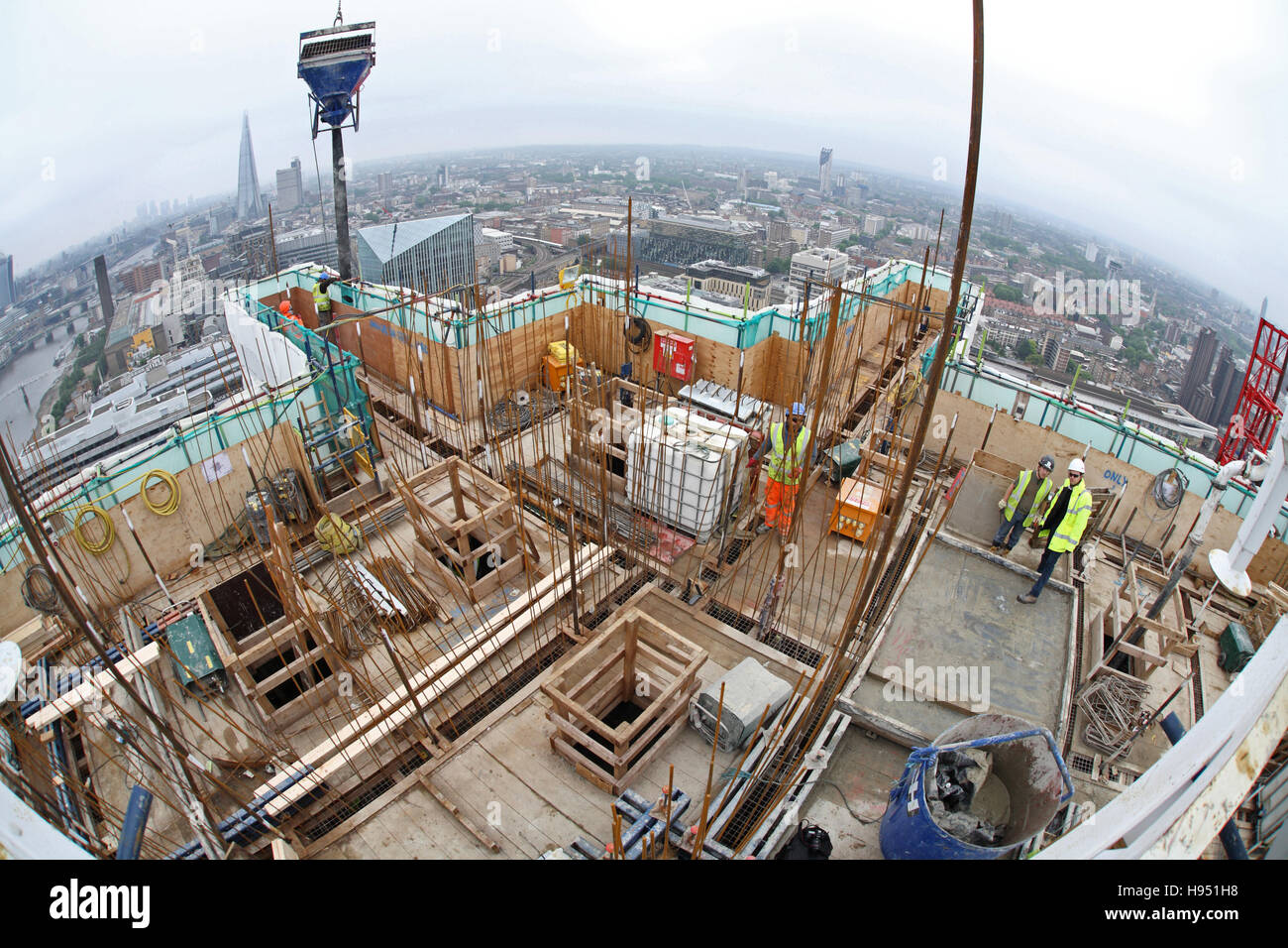 Construction of a new tower block on the south bank of the River Thames in London UK. Fish-eye view shows skyline beyond Stock Photo