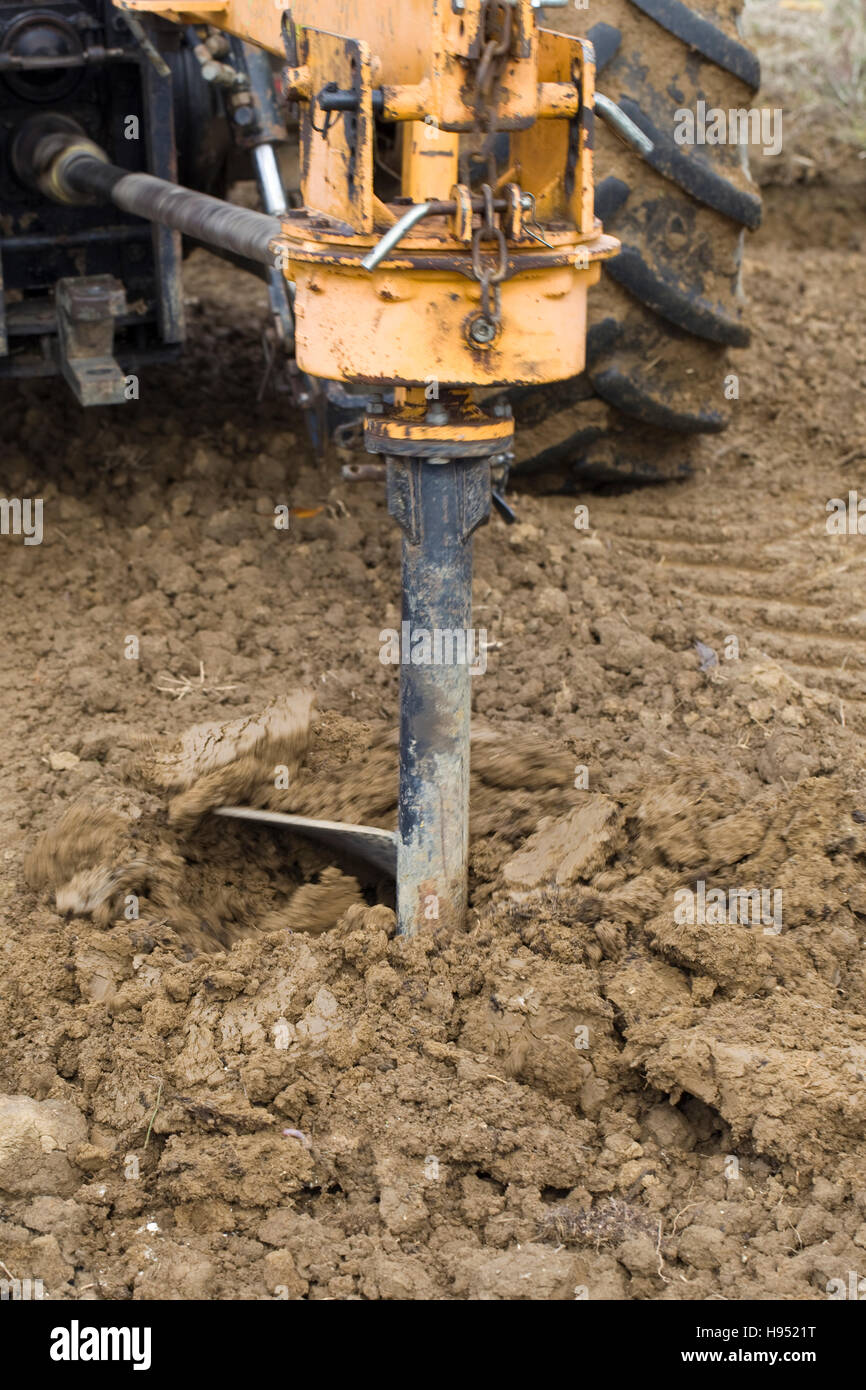 Drilling Rig Boring Hole in Clay Soil at Construction Site Stock Photo