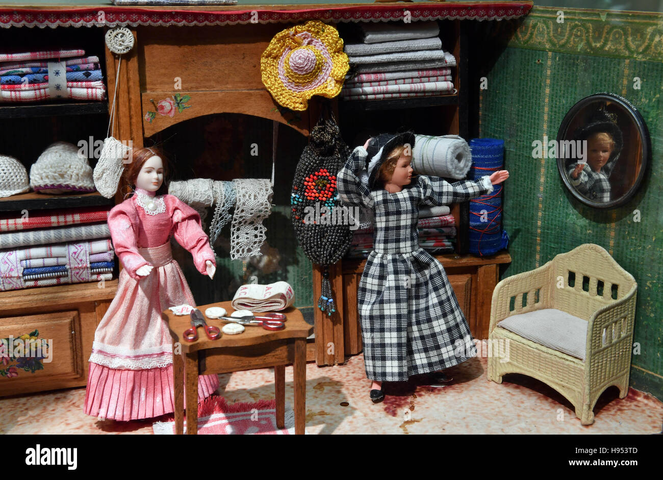 Gotha, Germany. 18th Nov, 2016. A clothing store can be seen at the special exhibition 'Paeckchen, Doeschen, Riesenrad - Kauflaeden und Marktstaende aus der Sammlung Rebettge-Schneider, Erfurt' (lit. 'Parcel, can, ferriswheel - Shops and market stands from the collection Rebettge-Schneider, Erfurt') at the historical museum in Gotha, Germany, 18 November 2016. The whole spectre of retail with roughly 30 exhibits from the start of the 19th century until today can be seen at the exhibition. PHOTO: MARTIN SCHUTT/dpa/Alamy Live News Stock Photo