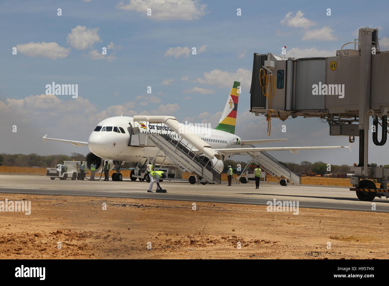 (161118) -- VICTORIA FALLS (ZIMBABWE), Nov. 18, 2016 (Xinhua) -- An Air Zimbabwe airplane is seen on the runway of Victoria Falls International Airport in Victoria Falls, Zimbabwe, on Nov. 18, 2016. Zimbabwean President Robert Mugabe on Friday commissioned the upgraded Victoria Falls International Airport that was built with support from China. (Xinhua/Chen Yaqin) Stock Photo