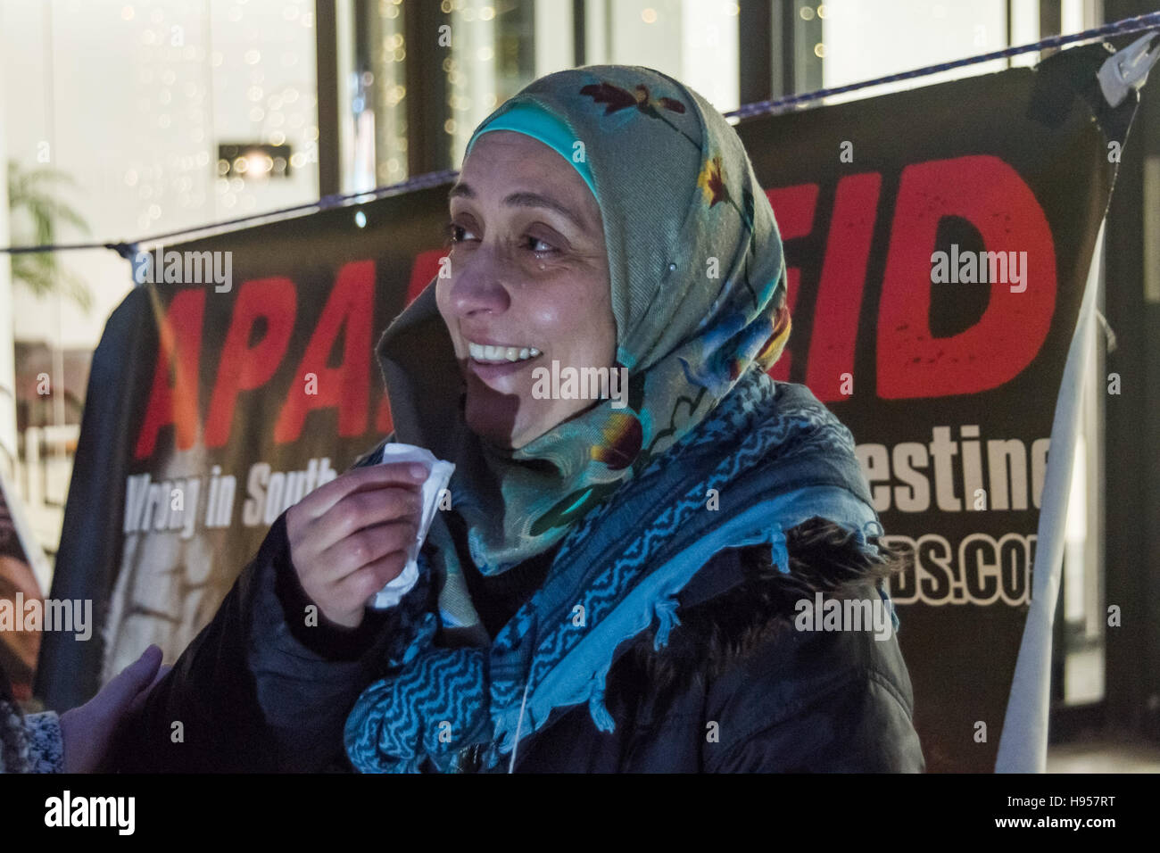 London, UK. 18th November 2016. Laila Sharary, wife of Fayez Shahary, talks about the arrest of her husband at the protest by human rights group Inminds outside the headquarters of British security company G4S over the abduction by Israel and subsequent torture of British national and father of five Fayez Sharary. Arrested by Israeli forces  on 15 September when leaving the West Bank for Jordan with his wife and youngest child to fly home after a family visit he was tortured for 3 weeks by Israeli secret police to force a confession An Israeli judge declared this worthless and inadmissible and Stock Photo