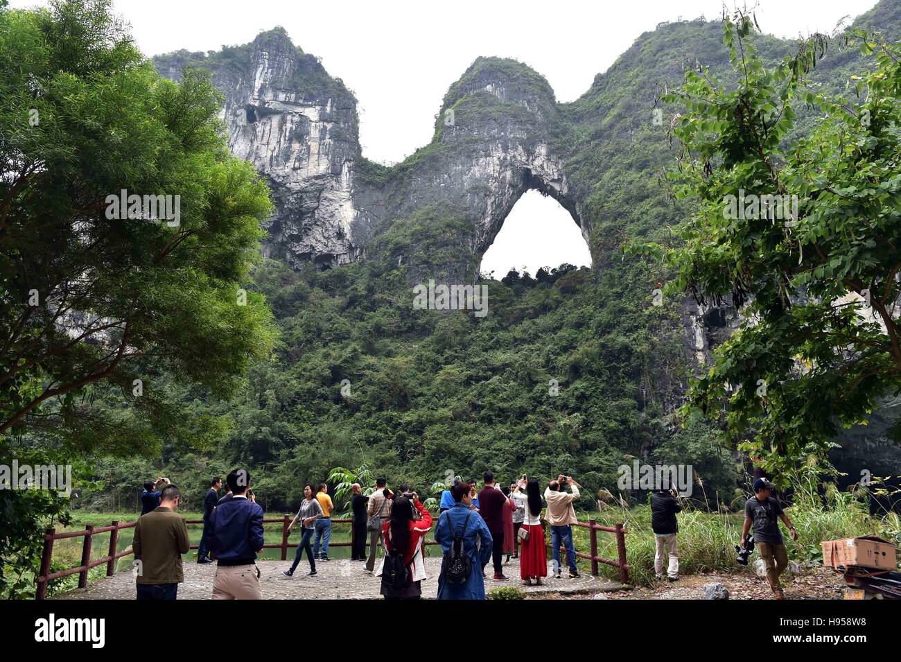 Hechi, China's Guangxi Zhuang Autonomous Region. 18th Nov, 2016. People  visit the Xiantuo Peak scenic spot in Donglan County of Hechi City, south  China's Guangxi Zhuang Autonomous Region, Nov. 18, 2016. ©