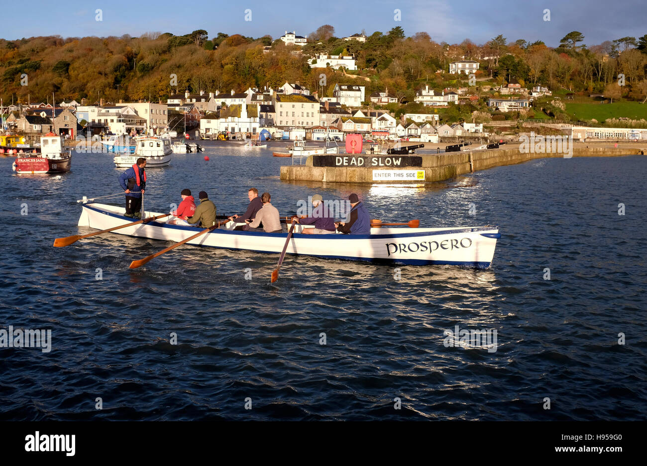 Lyme Regis Dorset, UK. 19th Nov, 2016. Members of the Lyme Gig Club head out to sea from Lyme Regis on a beautiful early morning in Dorset Credit:  Simon Dack/Alamy Live News Stock Photo
