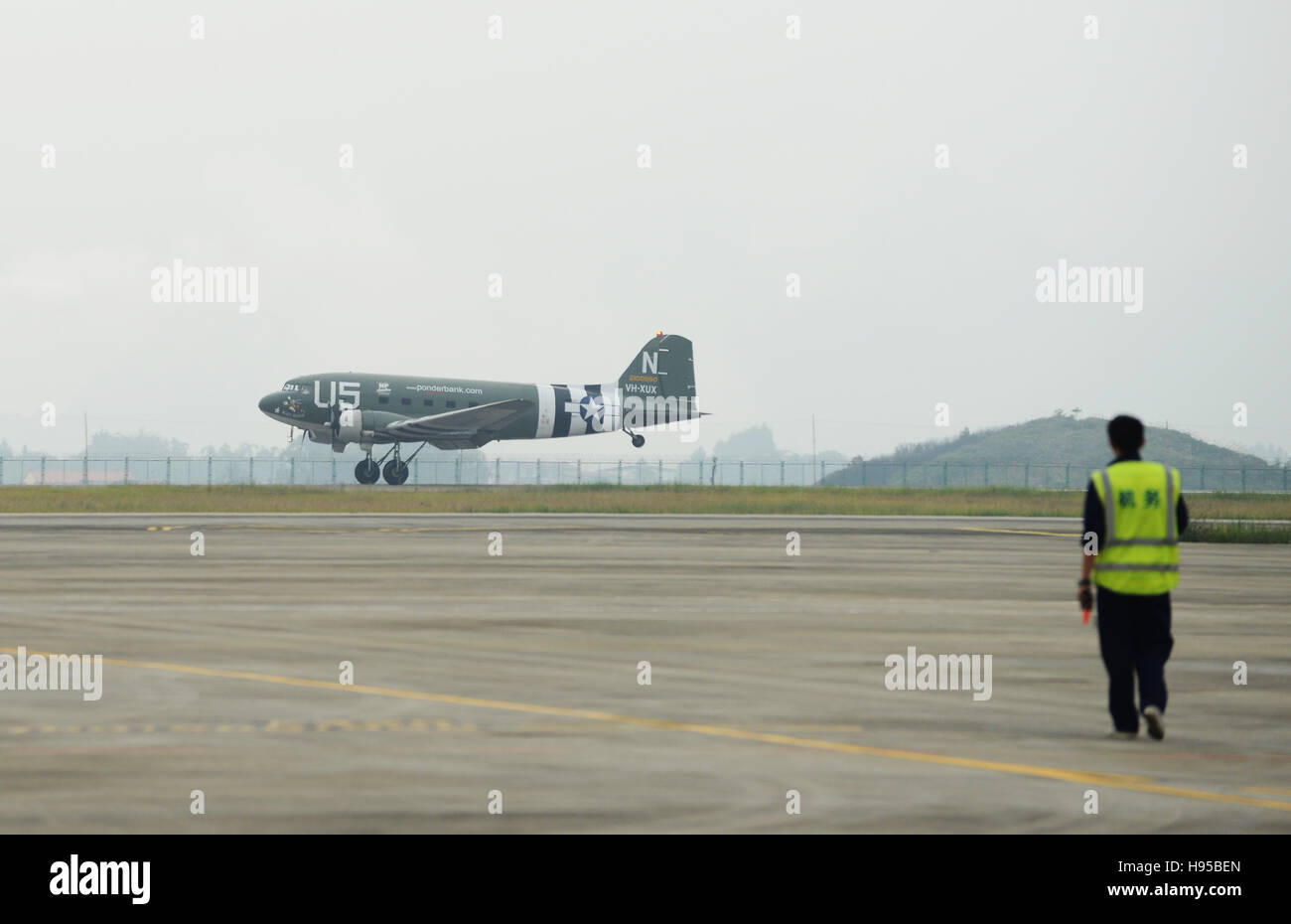 Guilin, China. 19th Nov, 2016. A C-47 aircraft, contributed by the Flying Tiger Historical Organization in the United States, lands at the Liangjiang airport in Guilin, south China's Guangxi Zhuang Autonomous Region, Nov. 19, 2016. The plane used in the Australian battleground during World War II reached south China's Guilin, after it repeated a flight of the dangerous 'hump route' over the Himalayas, a route flown by the famous U.S. Flying Tigers. It will be permanently displayed at the Flying Tigers Heritage Park in Guilin. Credit:  Xinhua/Alamy Live News Stock Photo