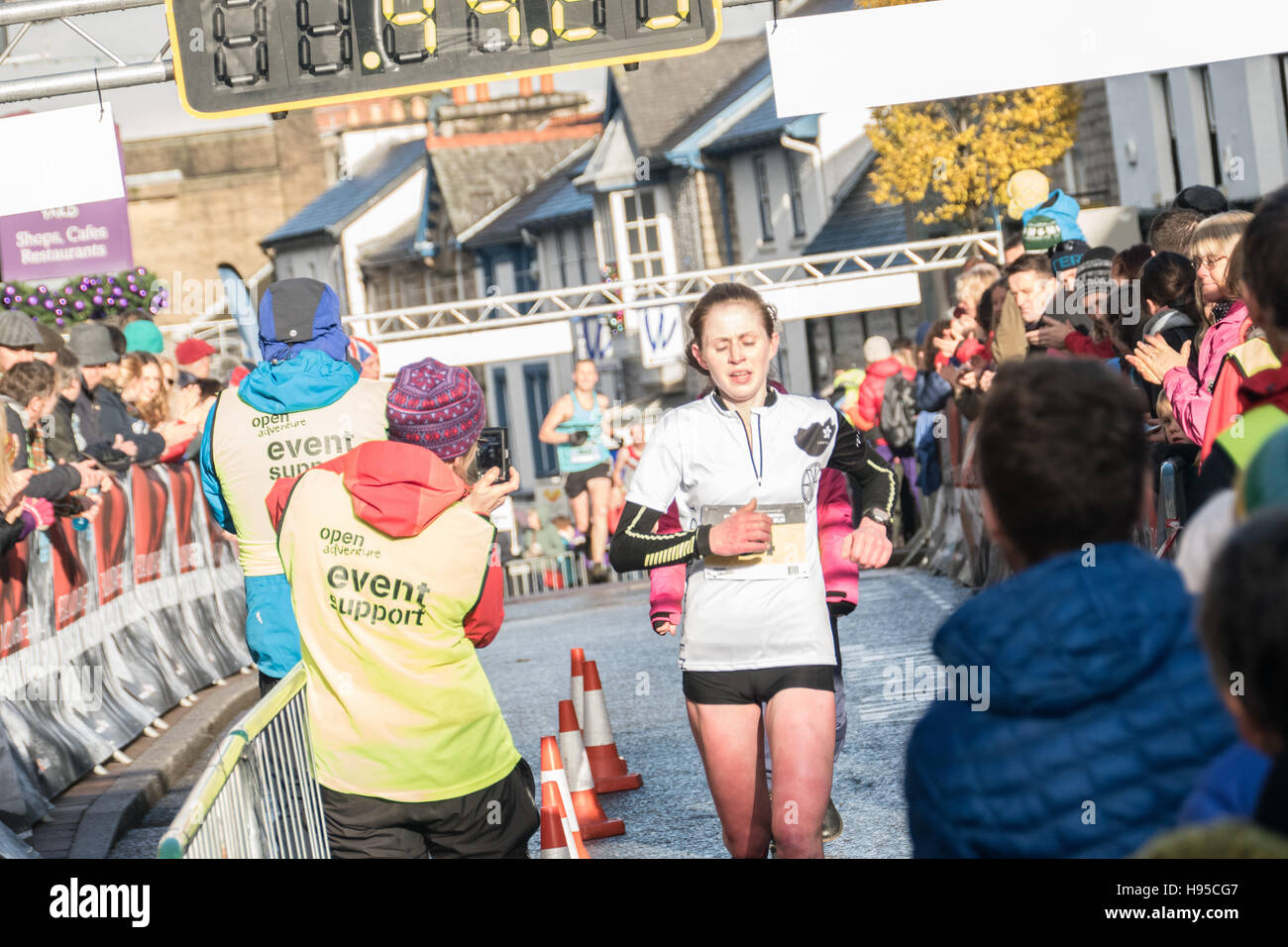 Kendal Cumbria UK, 19th November 2016,Sport news, Kendal mountain festival 10k trail run gets under way. A packed Kendal watches on as the first home in the womens race is Heidi Dent.copyright Gary Telford/Alamy live news Stock Photo