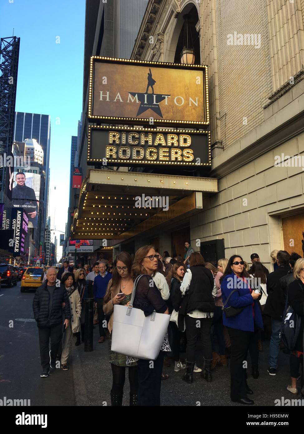 New York, NY, USA. 19th Nov, 2016. 'Hamilton' ticket holders wait in line at the Richard Rodgers Theater in Times Square the afternoon after Vice-President Elect Mike Pence was reportedly booed while attending a performance of the Broadway musical and where cast member Brandon Victor Dixon addressed Pence directly during the curtain call in New York, New York on November 19, 2016. © Rainmaker Photo/Media Punch/Alamy Live News Stock Photo