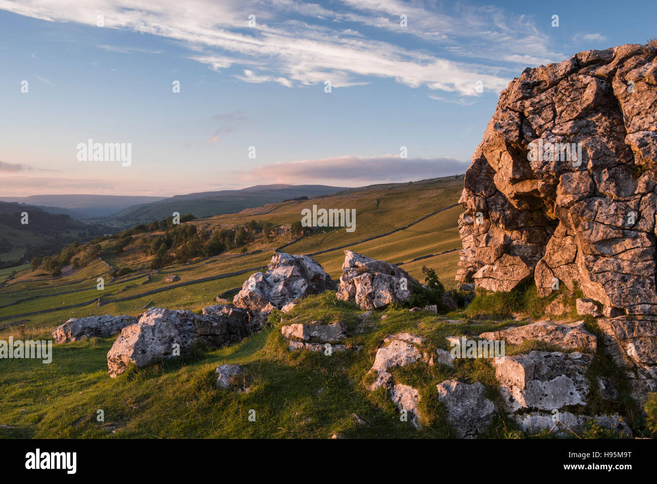 Summer evening view of beautiful Yorkshire Dales countryside seen from Conistone Pie, a limestone outcrop - North Yorkshire, GB. Stock Photo