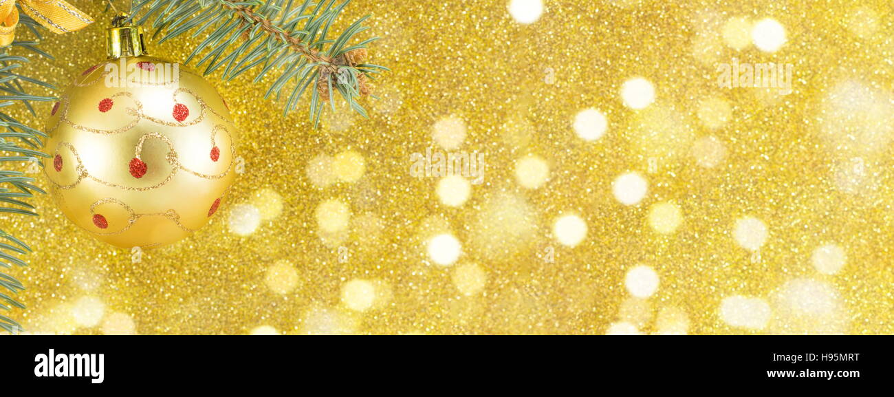 Christmas decorations against yellow shiny background Stock Photo