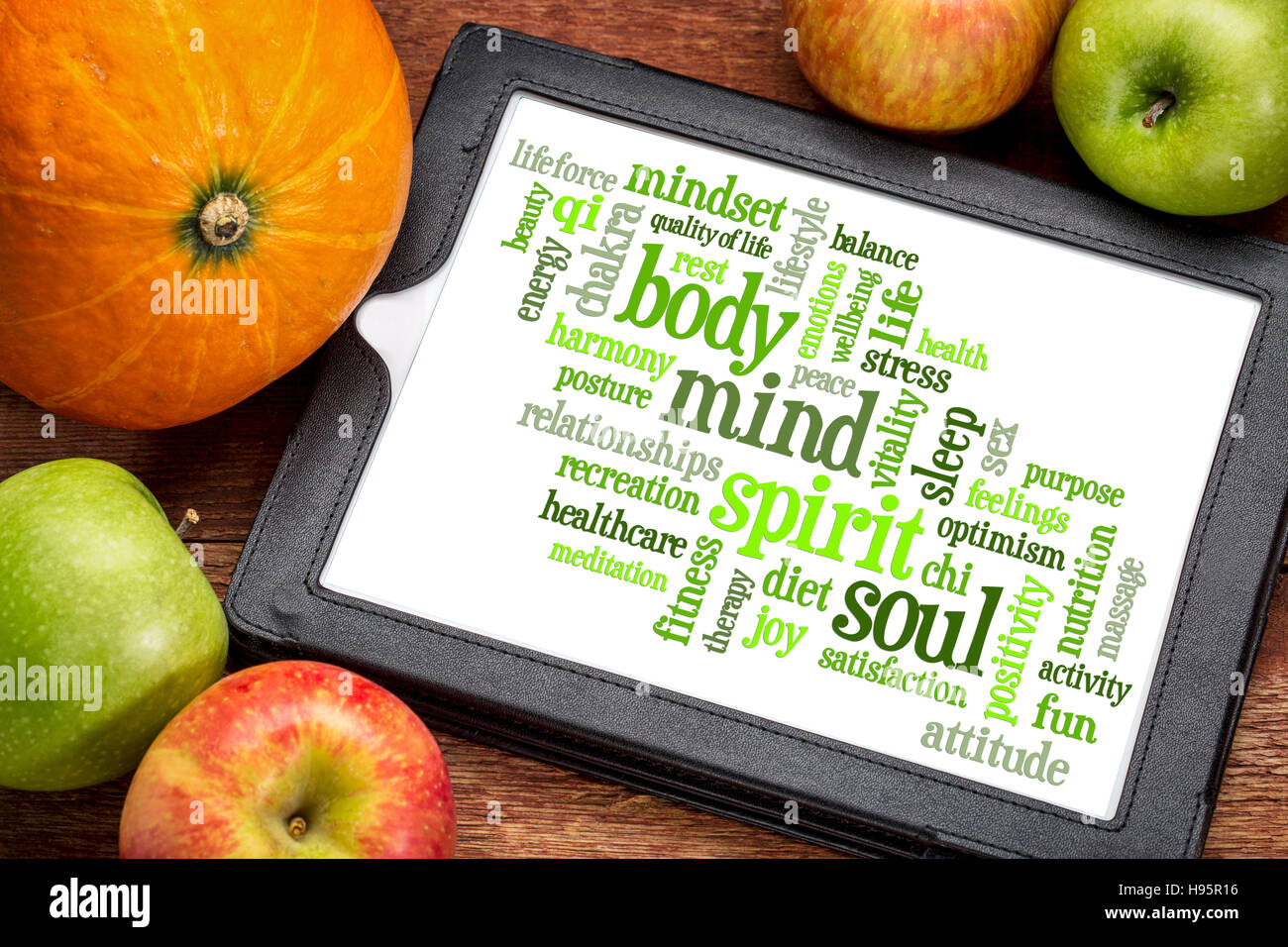 body, mind, spirit and soul - word cloud on a  digital tablet Stock Photo