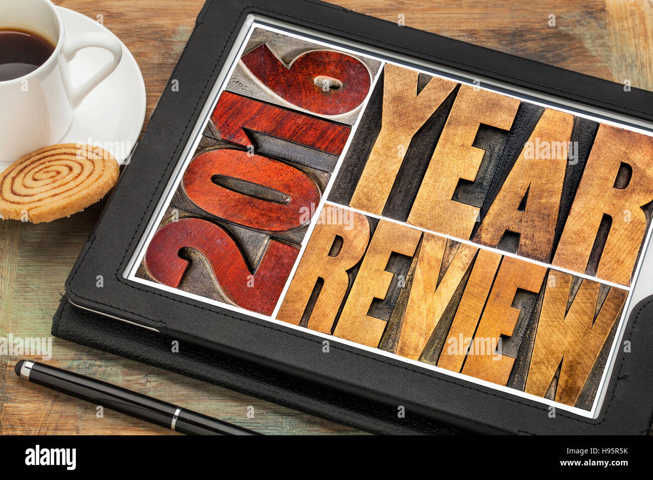 2016 review banner - annual review or summary of the recent year - word abstract in vintage letterpress wood type blocks on a digital tablet Stock Photo
