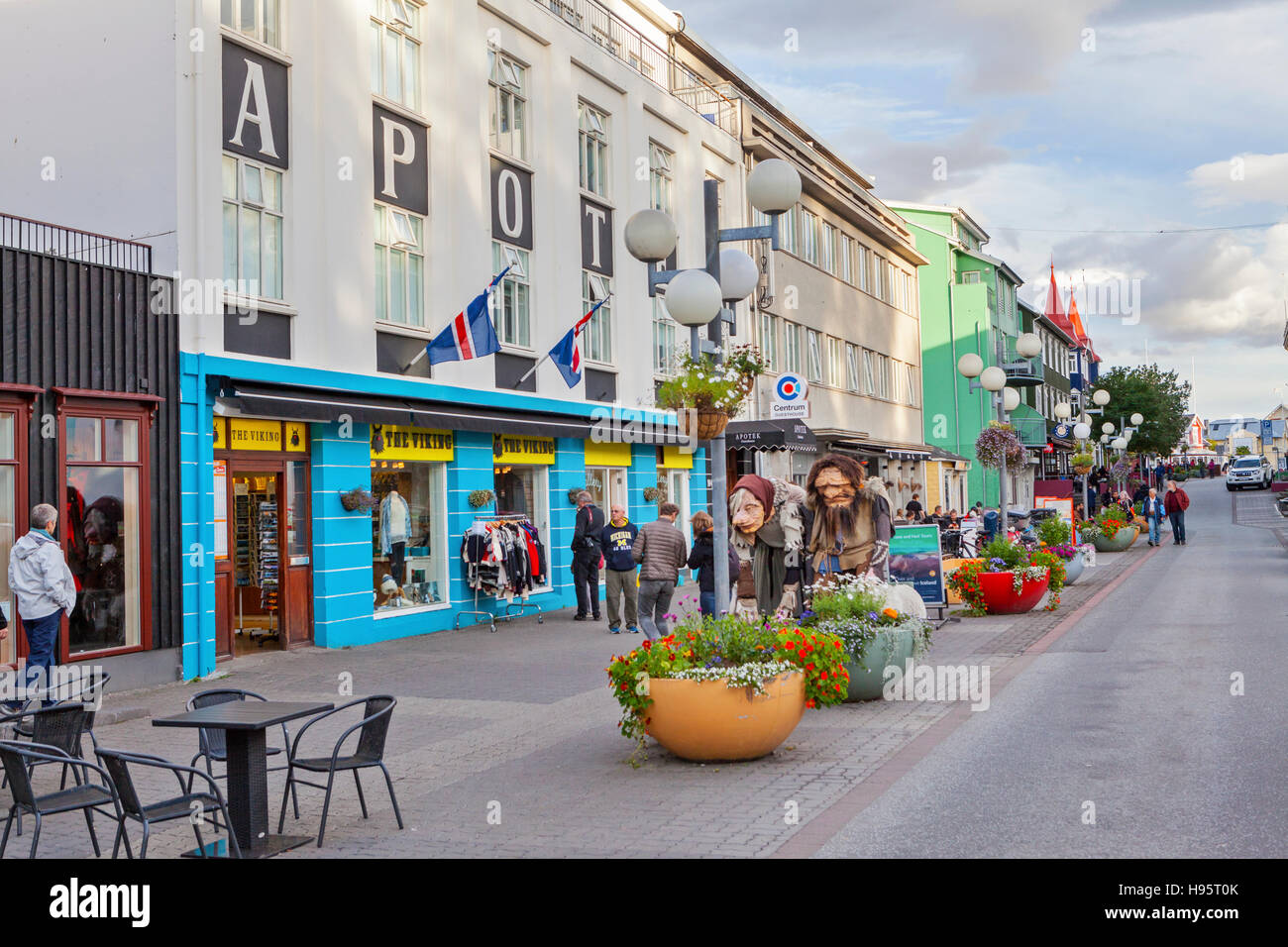 A view of tourists and pedestrians on Hafnarstraeti Street in the city of Akureyri, Iceland. Stock Photo