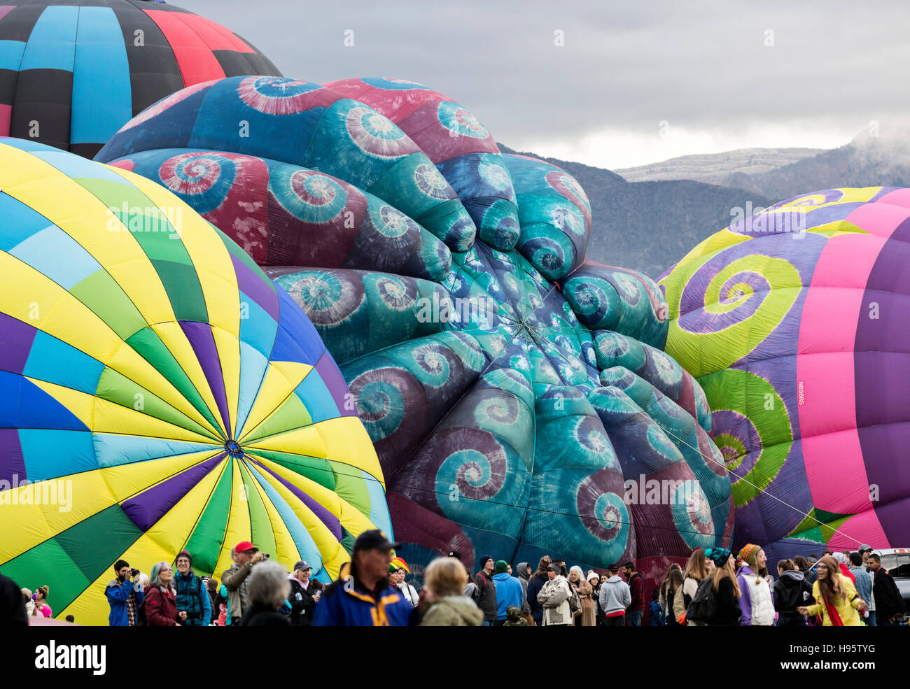 Hot air balloons preparing for early morning mass ascension at