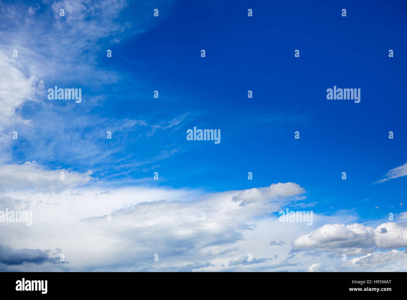 Blue sky with white clouds in a sunny summer day Stock Photo