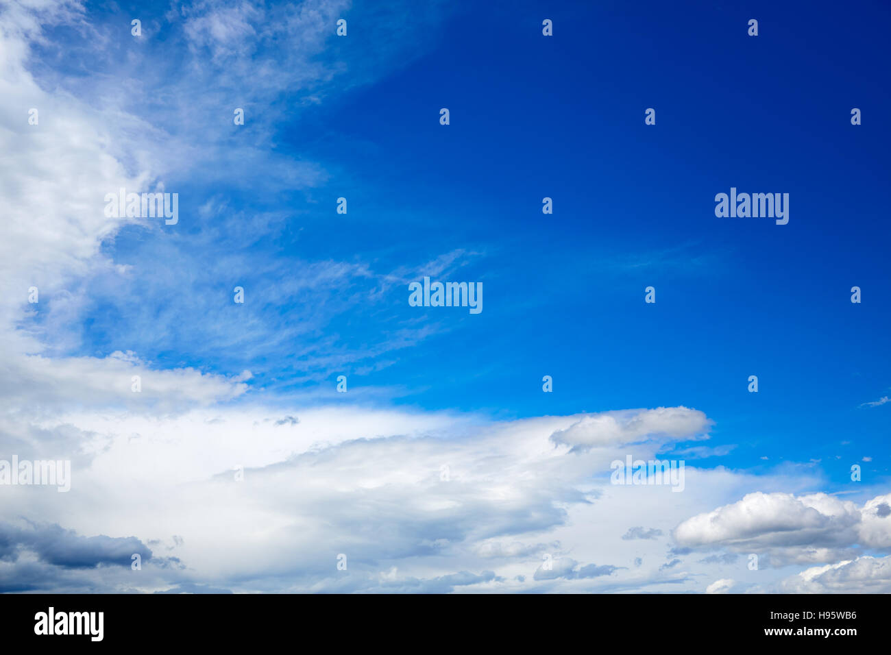 Blue sky with white clouds in a sunny summer day Stock Photo