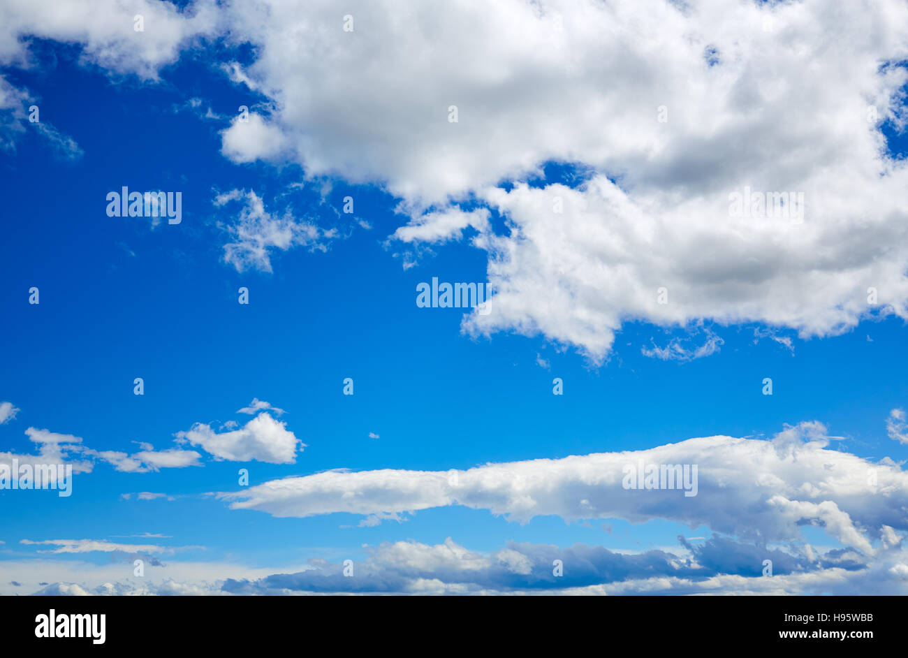 Blue sky with white clouds in a sunny summer day Stock Photo - Alamy