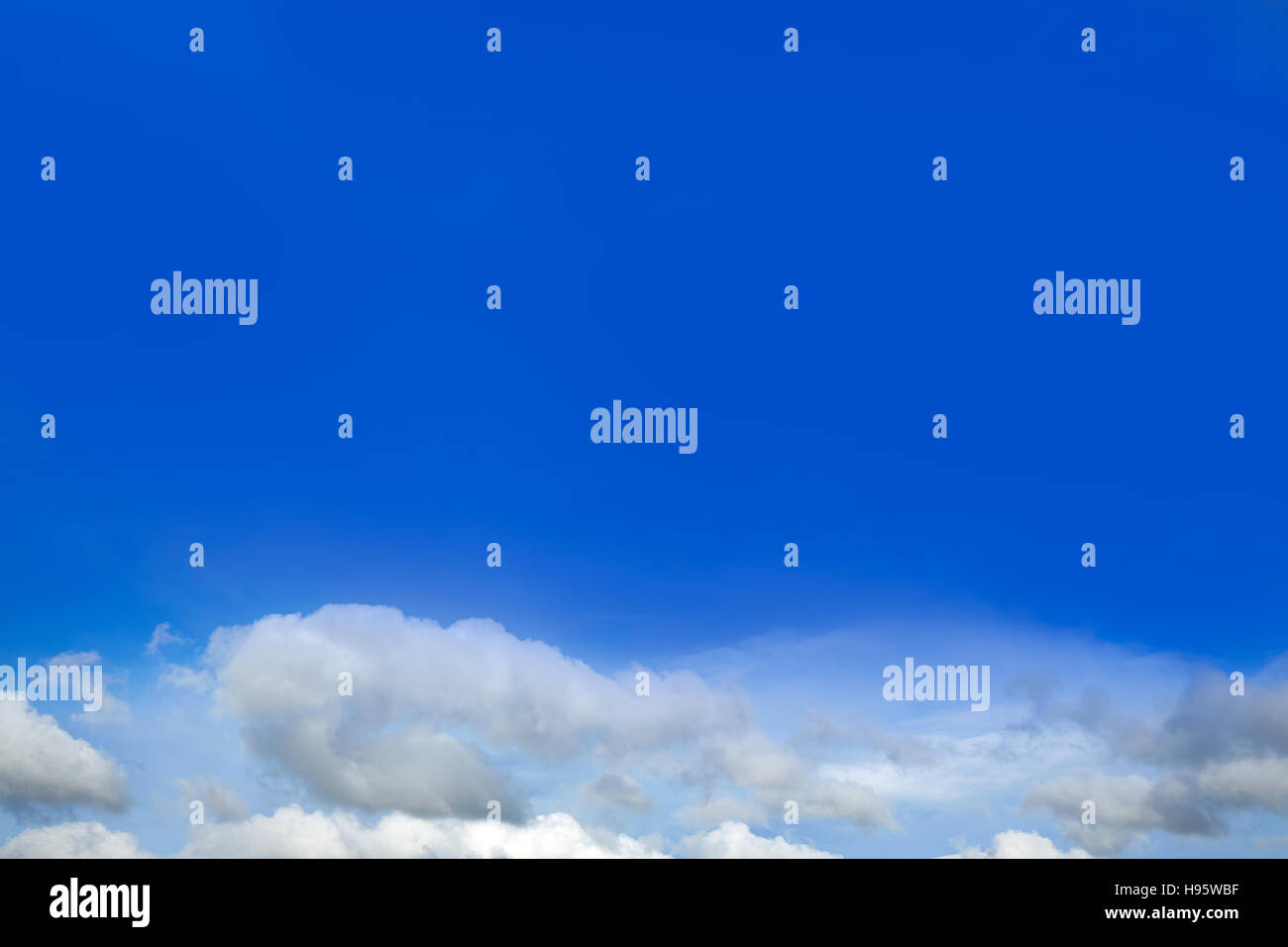 Blue sky with white clouds in a sunny summer day Stock Photo