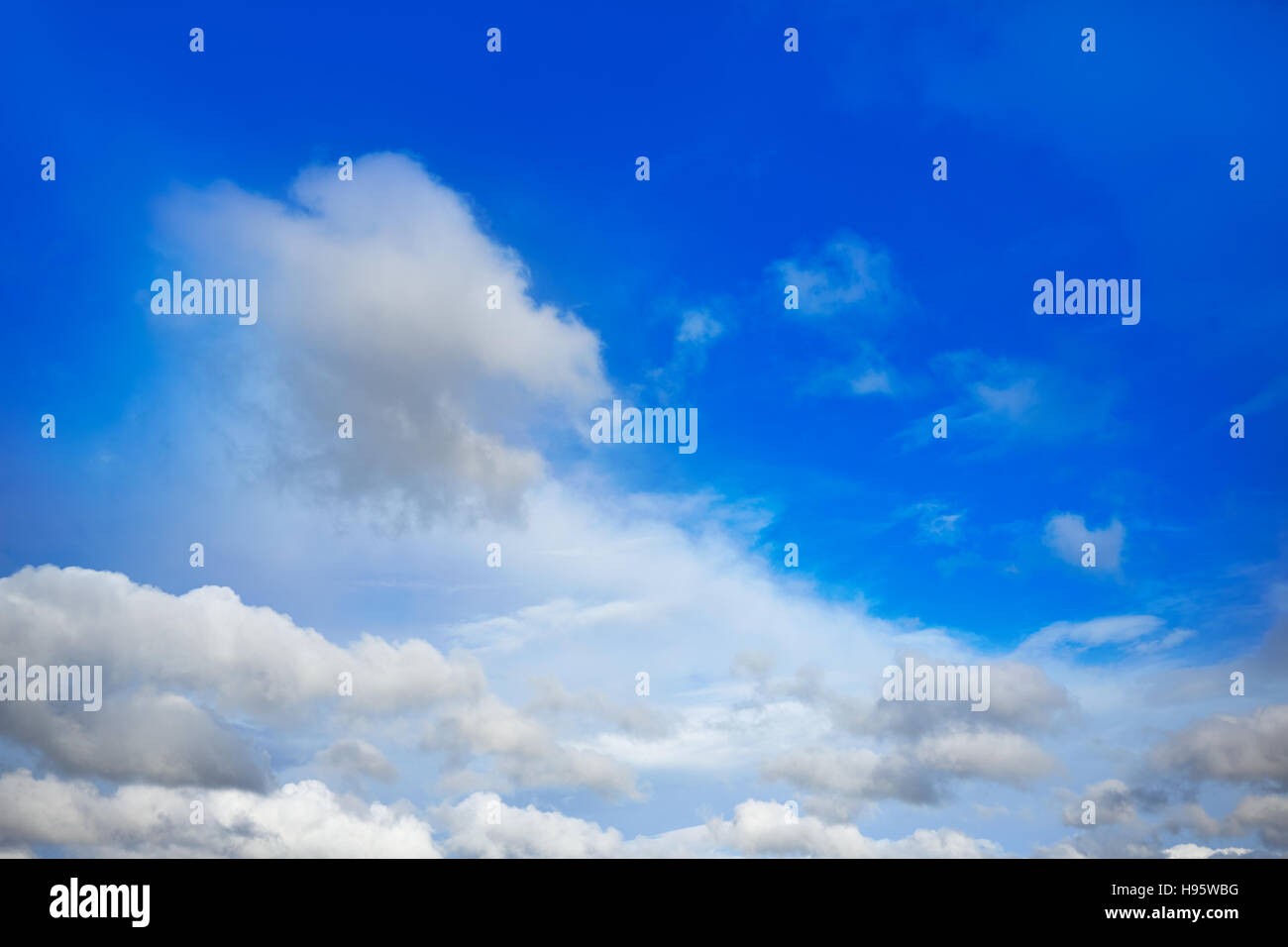 Blue sky with white clouds in a sunny summer day Stock Photo