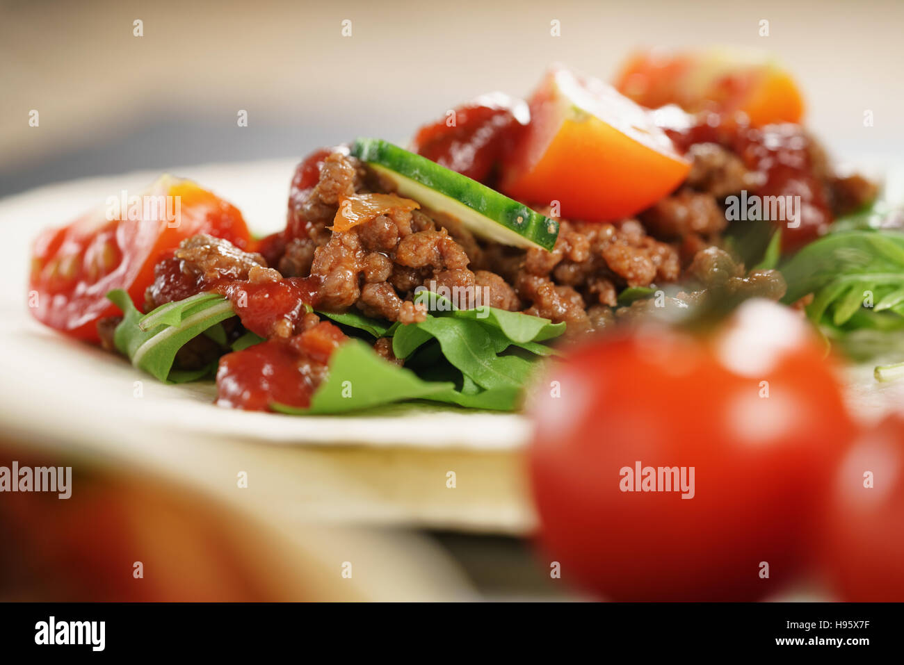 open tortilla with beef, frillice and vegetables Stock Photo