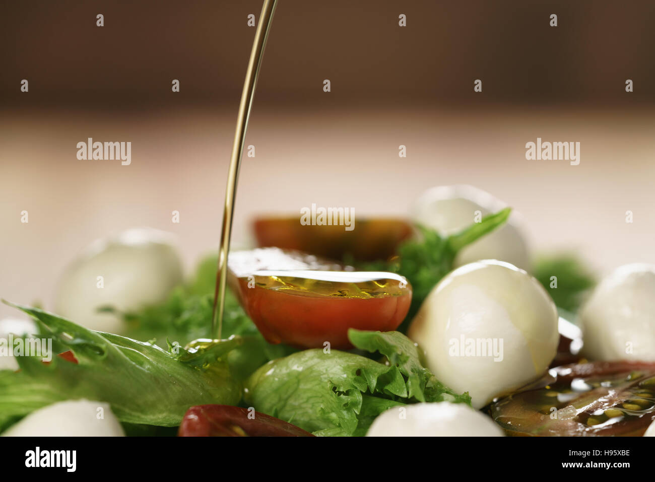 salad with kumato tomato, mozzarella and frillies lettuce Stock Photo