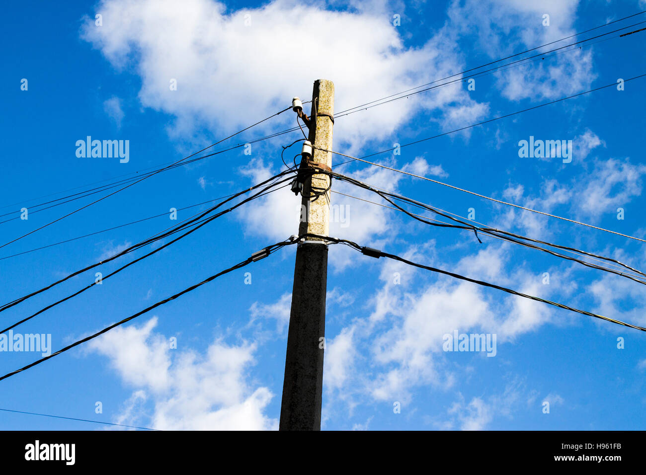 electric pole on a blue sky background Stock Photo - Alamy
