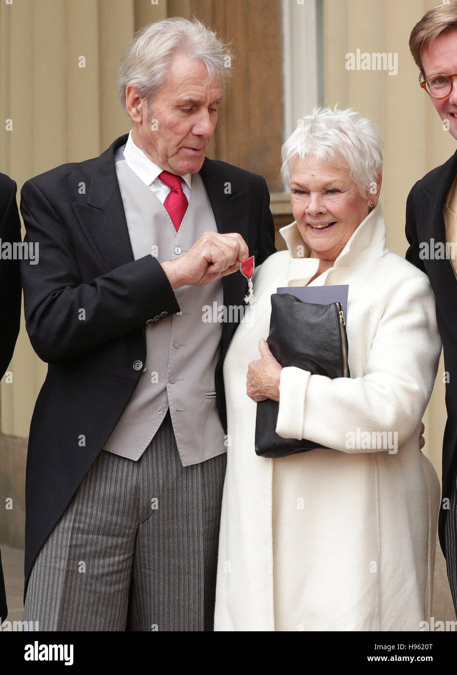 Dame Judi Dench with David Mills with his MBE which he received by the Prince of Wales during an Investiture ceremony at Buckingham Palace, London. Stock Photo