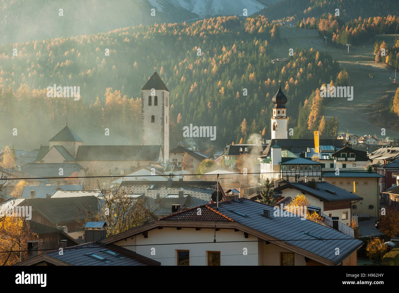 Misty autumn morning in San Candido (Innichen), South Tyrol, Italy. Stock Photo