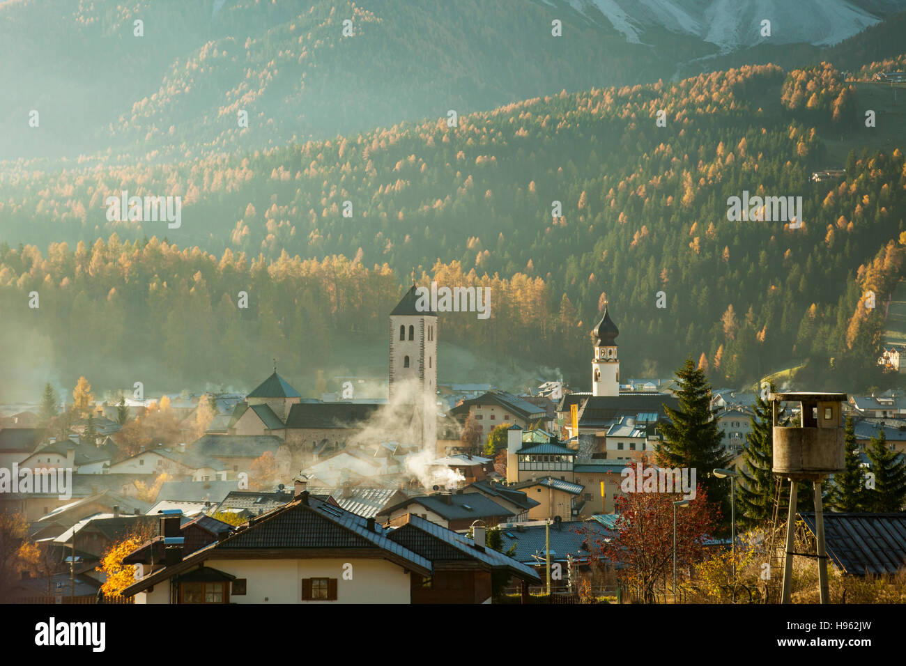 Misty autumn morning in San Candido (Innichen), South Tyrol, Italy. Dolomites. Stock Photo