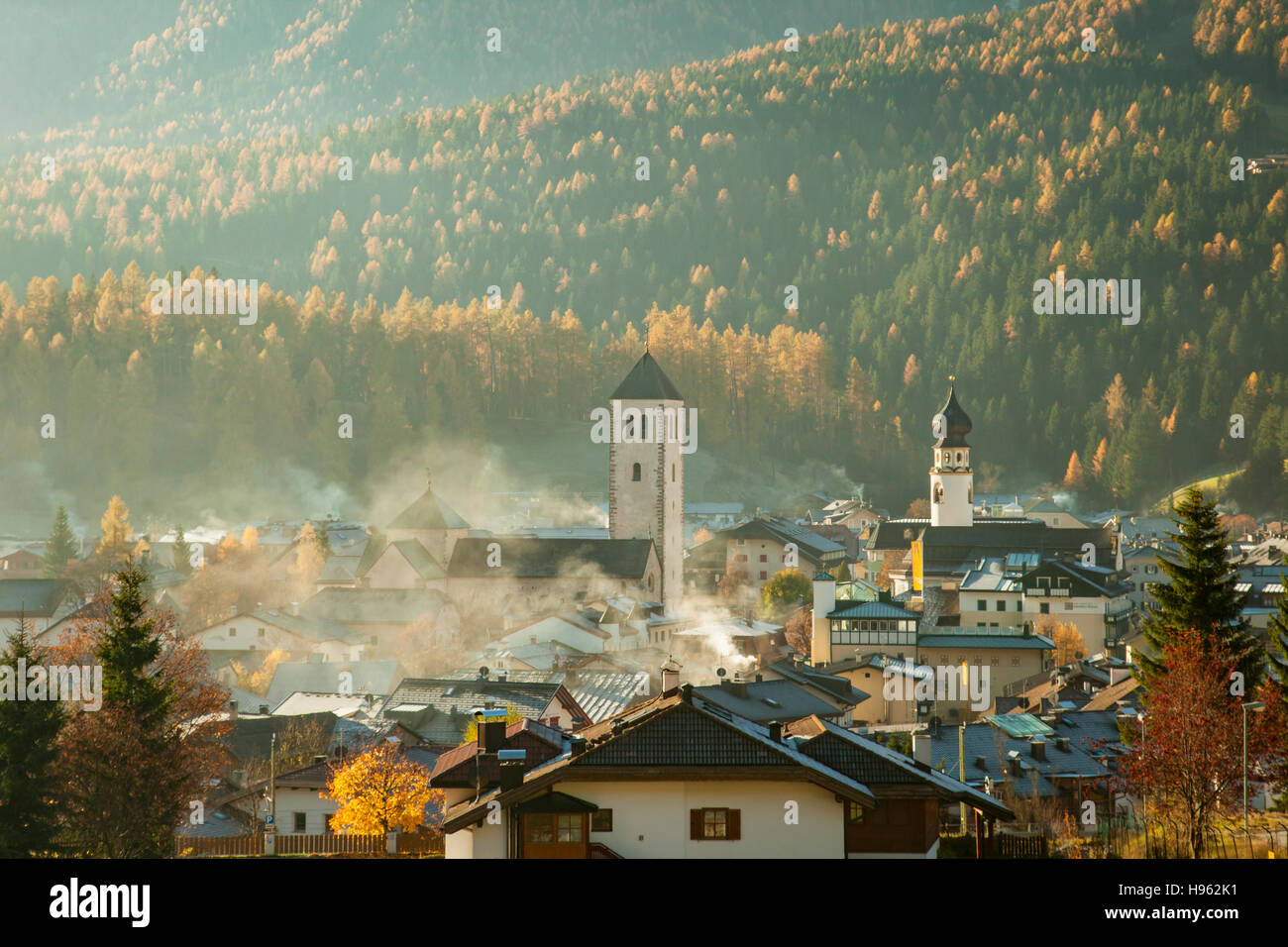 Misty autumn morning in San Candido (Innichen), South Tyrol, Italy. Dolomites. Stock Photo