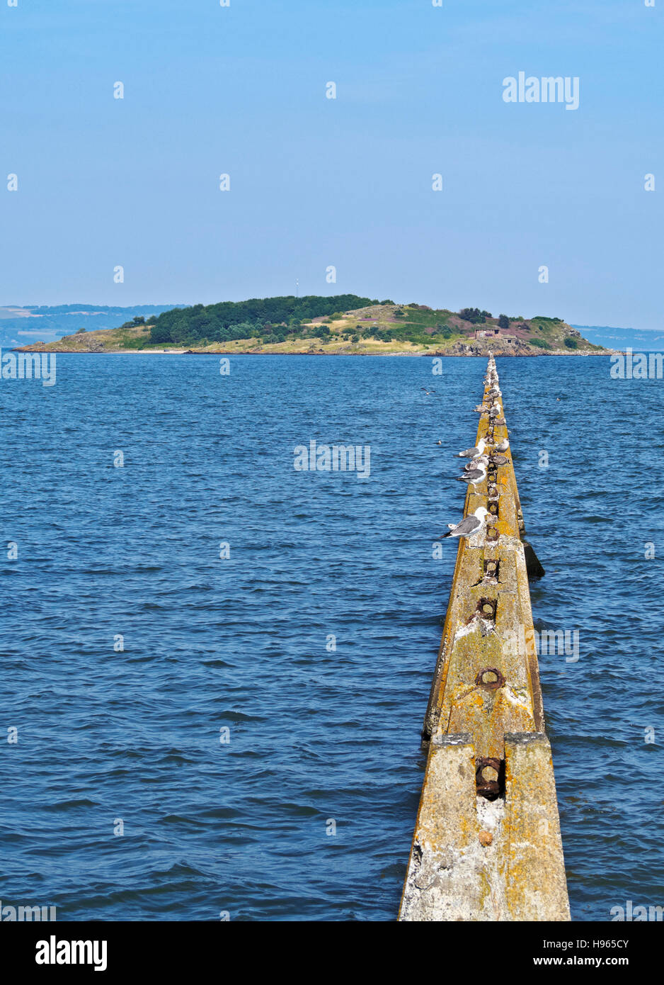 UK, Scotland, Lothian, Edinburgh Area, Cramond, Causeway and Pylons leading to the Cramond Island at high tide. Stock Photo
